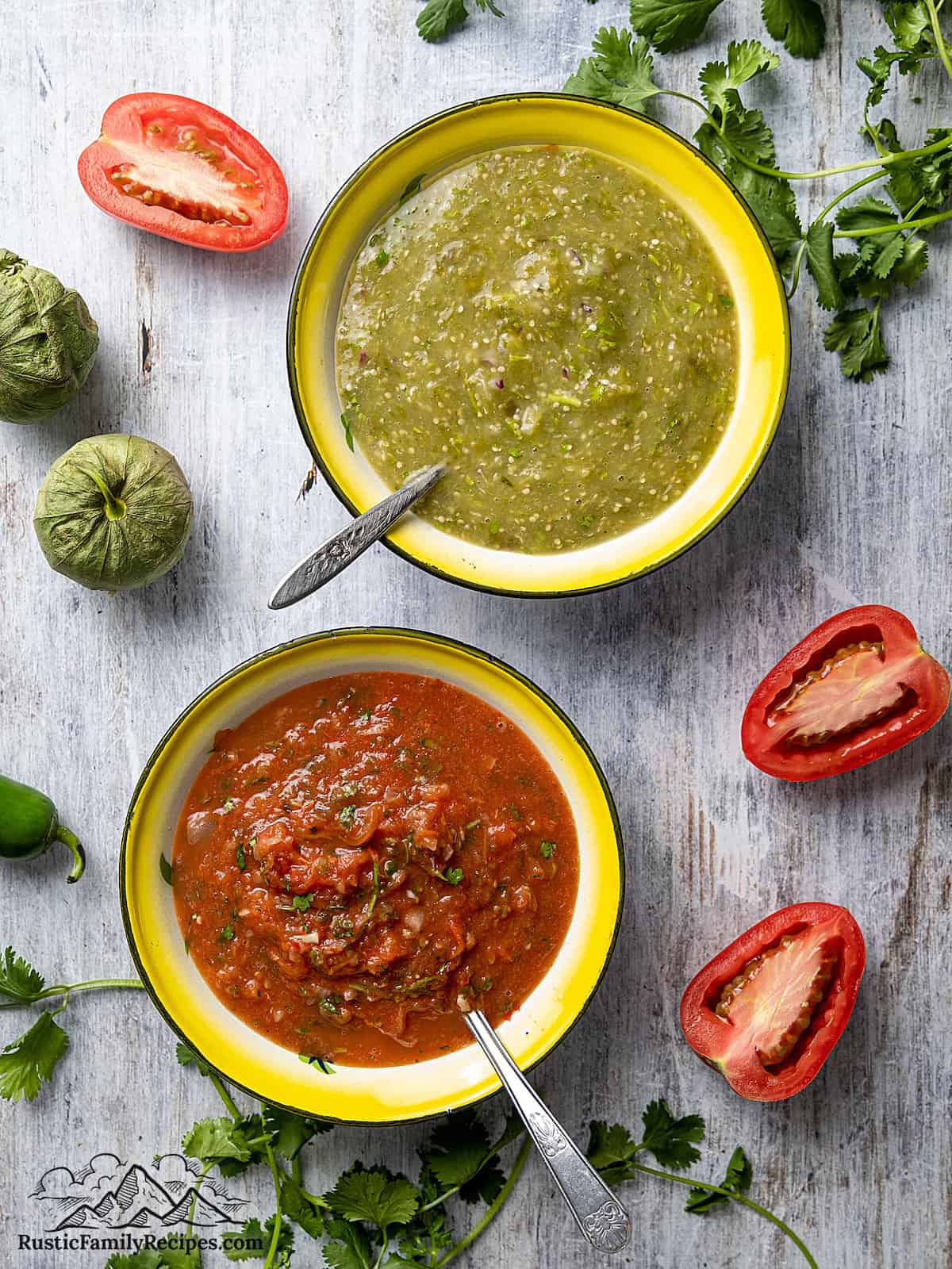 Bowls of green roasted tomatillo salsa and roasted red tomato salsa