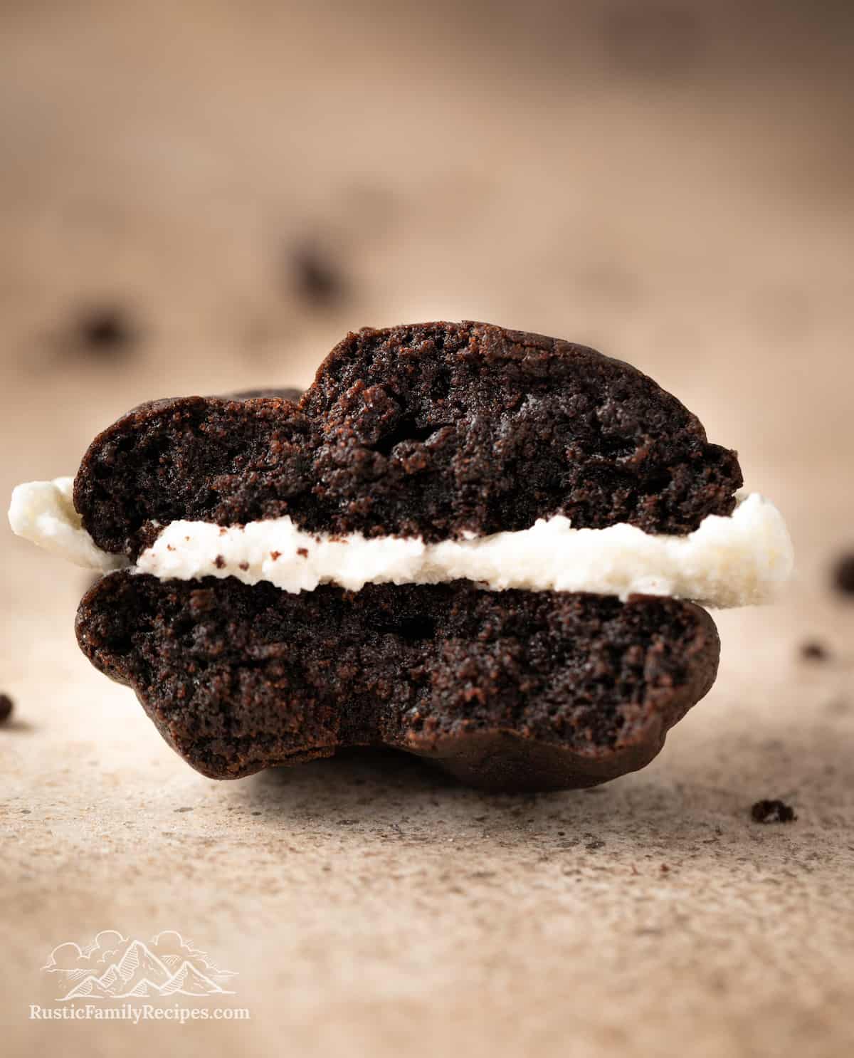 Close up of one half of an Oreo whoopie pie on a countertop.