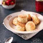 Baking powder shortcake biscuits piled in a white serving bowl.