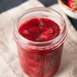 Mason jar filled with strawberry sauce