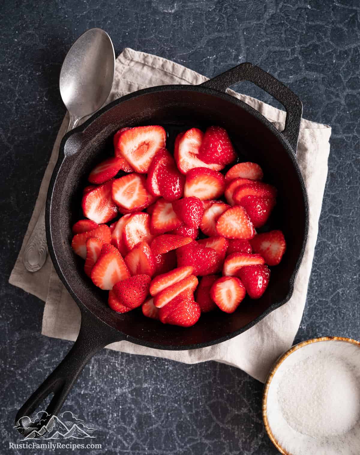 Sliced strawberries in a skillet