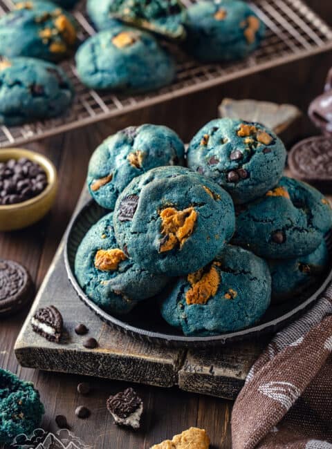 A plate piled with blue cookie monster cookies