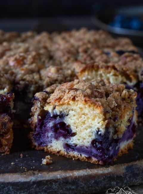 Close up of a slice of blueberry buckle.