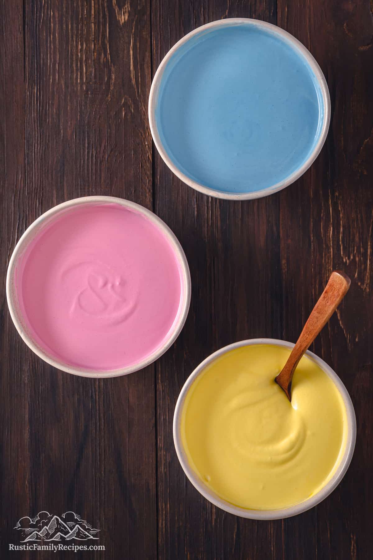 Top view of the three color varieties for Superman ice cream in separate bowls.
