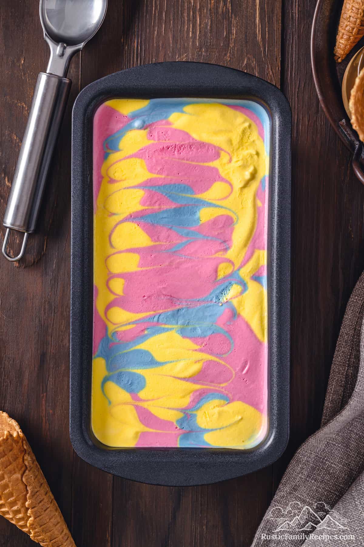 Top view of Superman ice cream swirled inside a loaf pan.