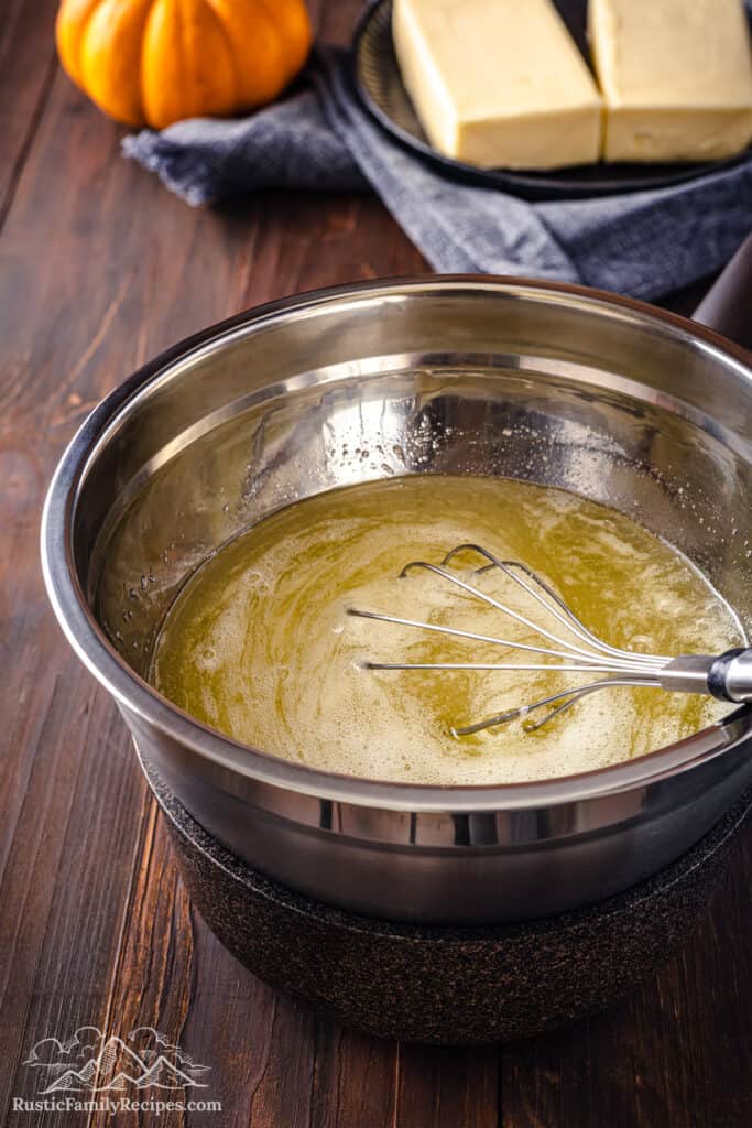 A bowl of egg whites and sugar warming over a double boiler.