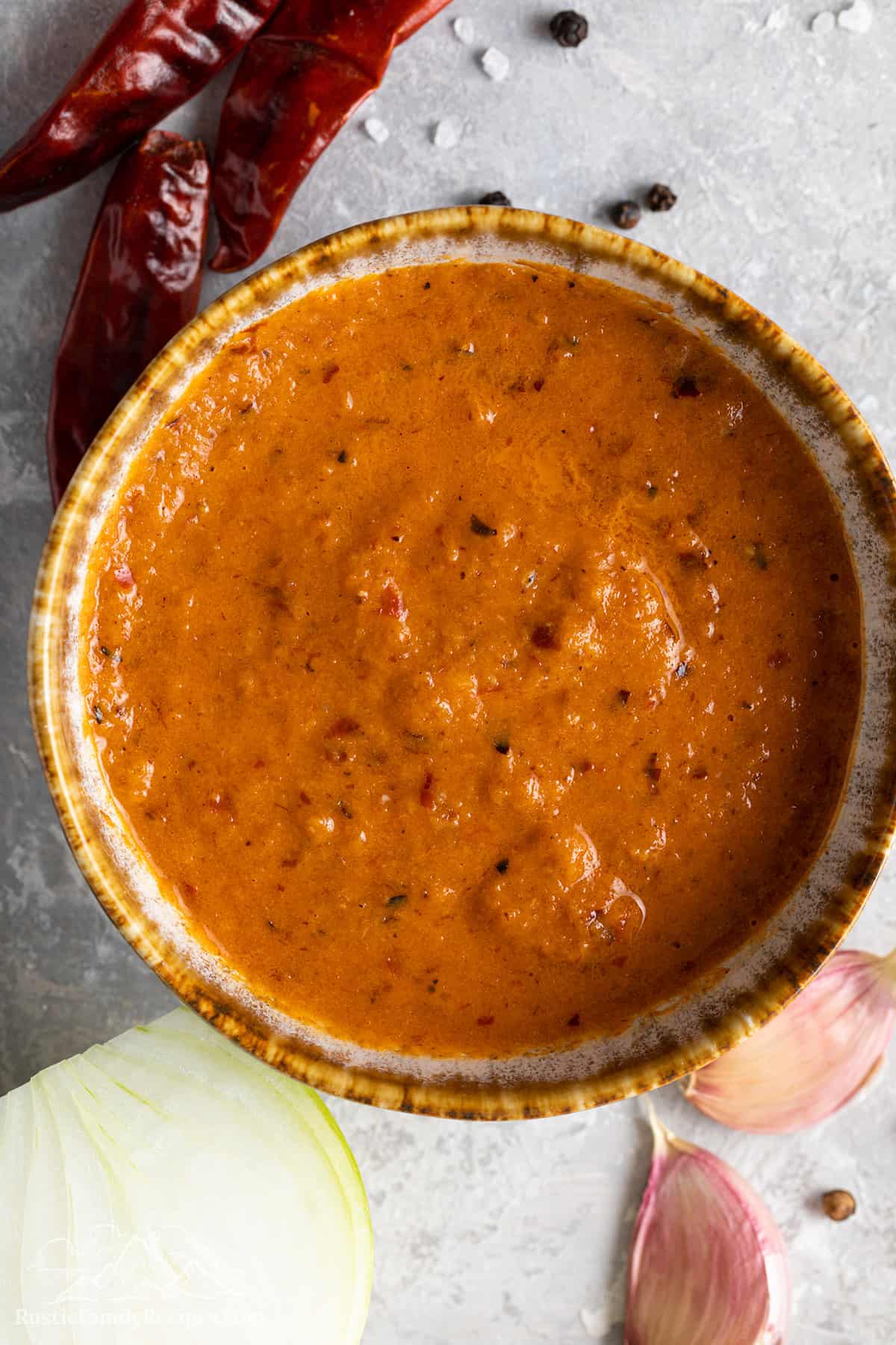 Unstrained guajillo pepper sauce for pambazos. 
