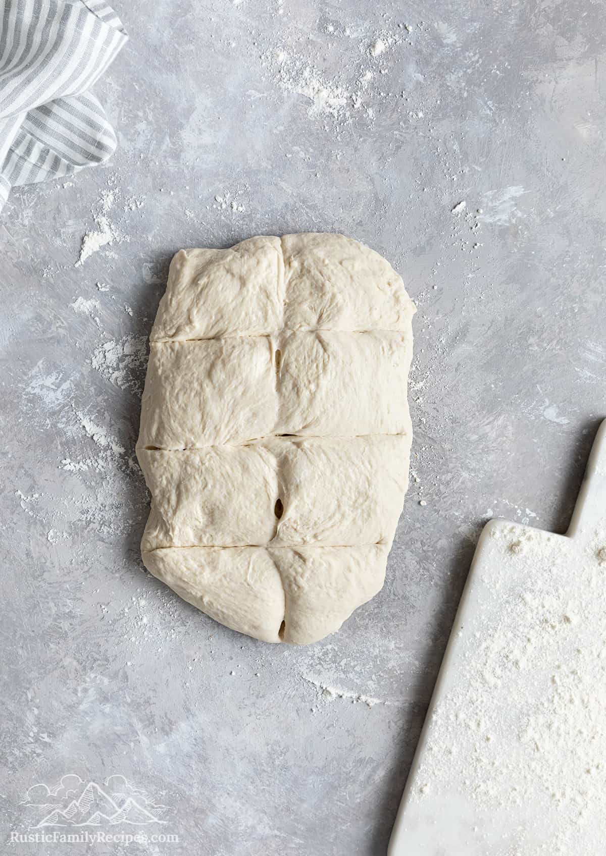 Dough sectioned into 8 equal pieces. 