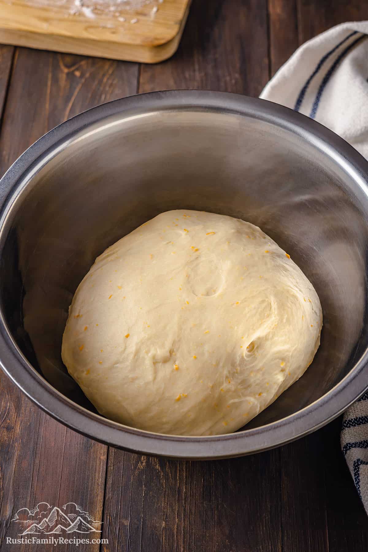 Pan de muerto dough in a bowl, before rising.
