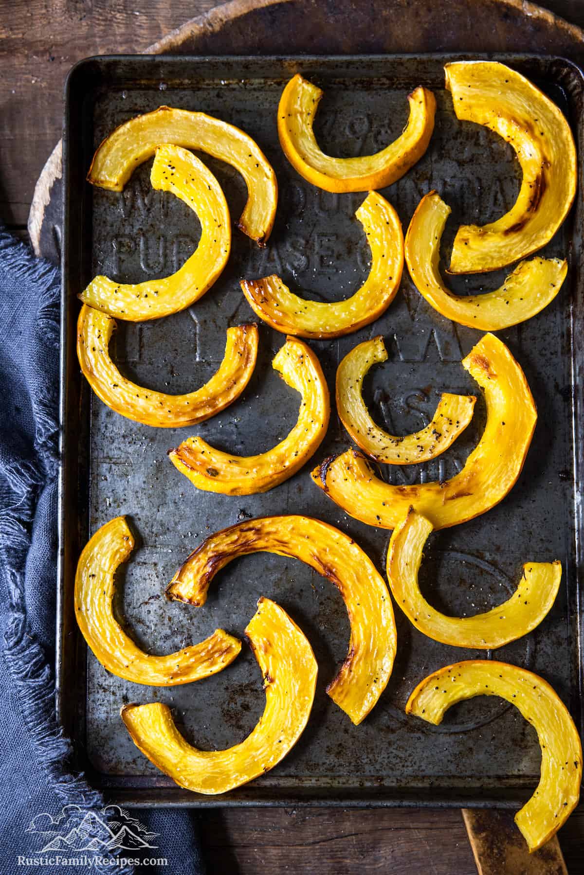 A baking sheet with roasted delicata squash