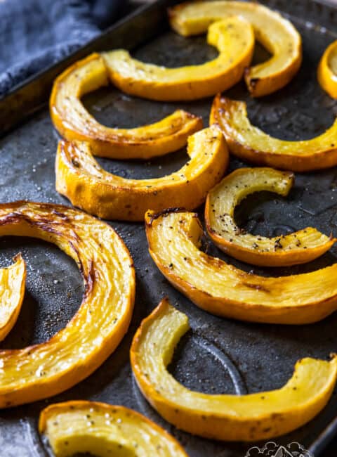 A baking sheet with roasted delicata squash