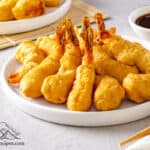 A plate filled with golden shrimp tempura
