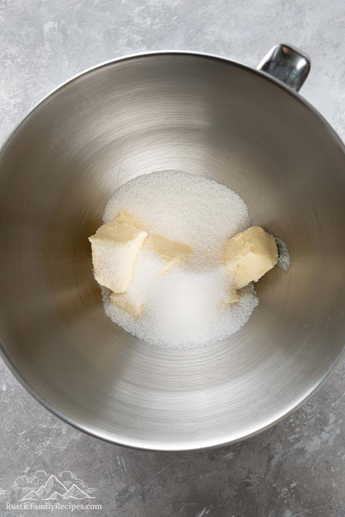 Sugar and butter in a mixing bowl before creaming.