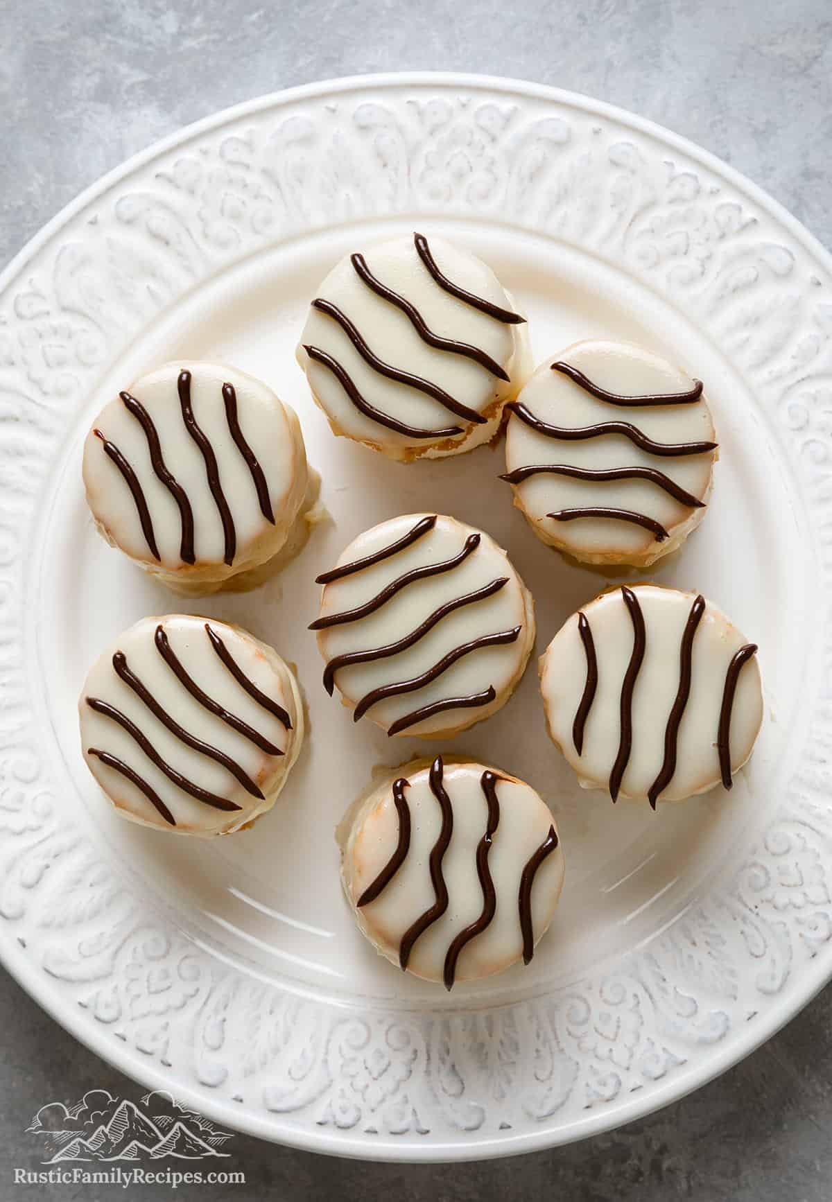 Decorated zebra cakes on a plate.