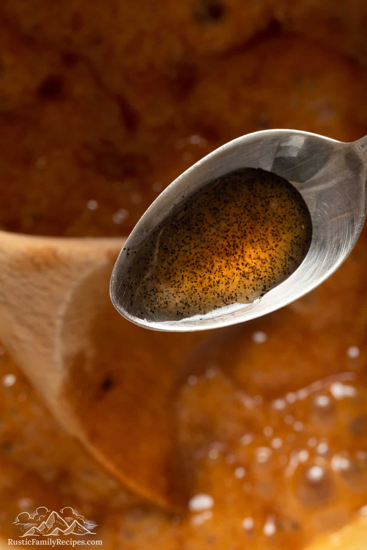 Liquid salted caramel sauce on a spoon.