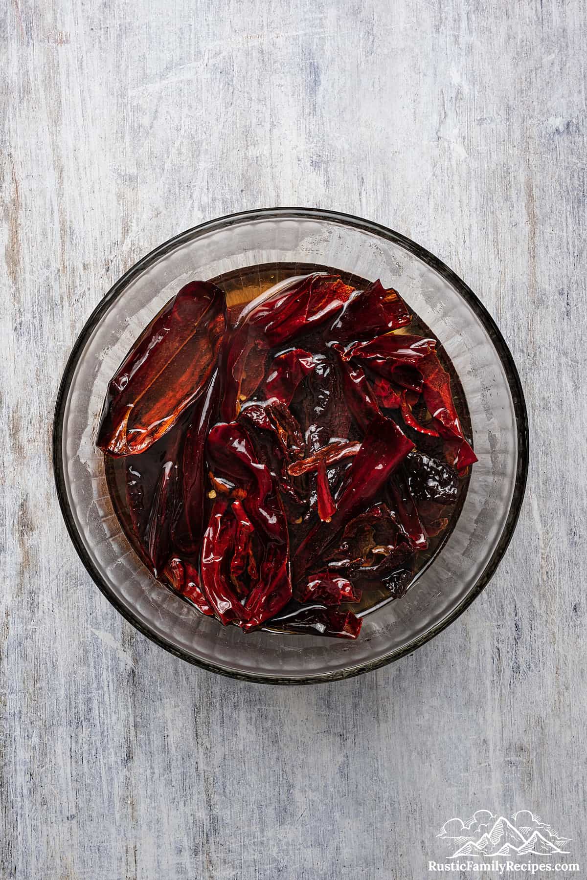 Hydrating the toasted chiles in boiling water.