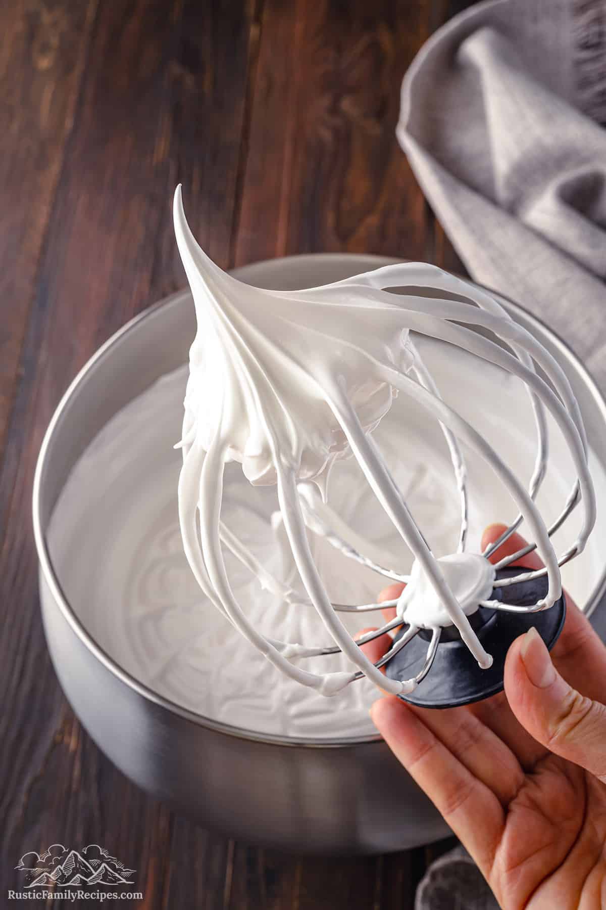 Marshmallow frosting on a whisk attachment.
