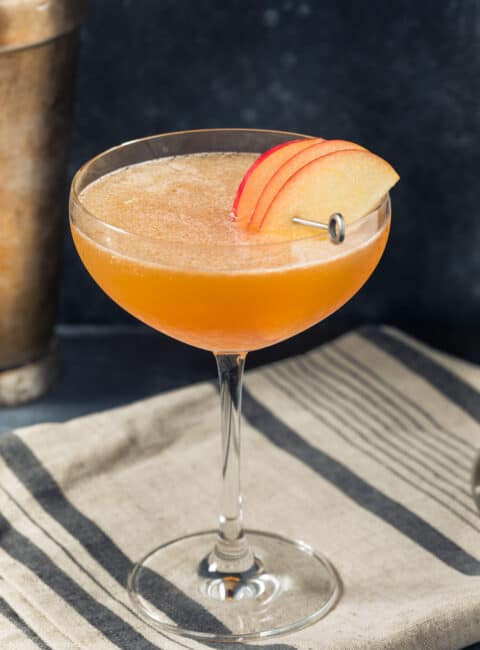 Apple Cider Martini in a glass on top of a kitchen towel