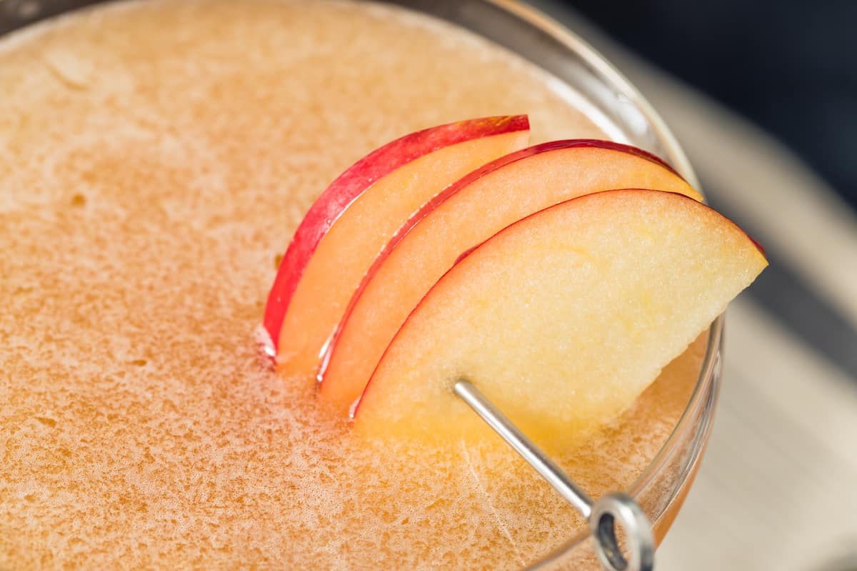 Close up of an Apple Cider Martini with apple slices
