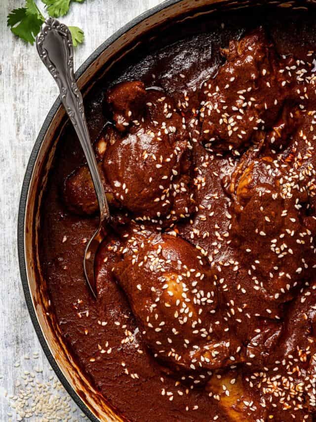 Close-up of mole con pollo in a pan.