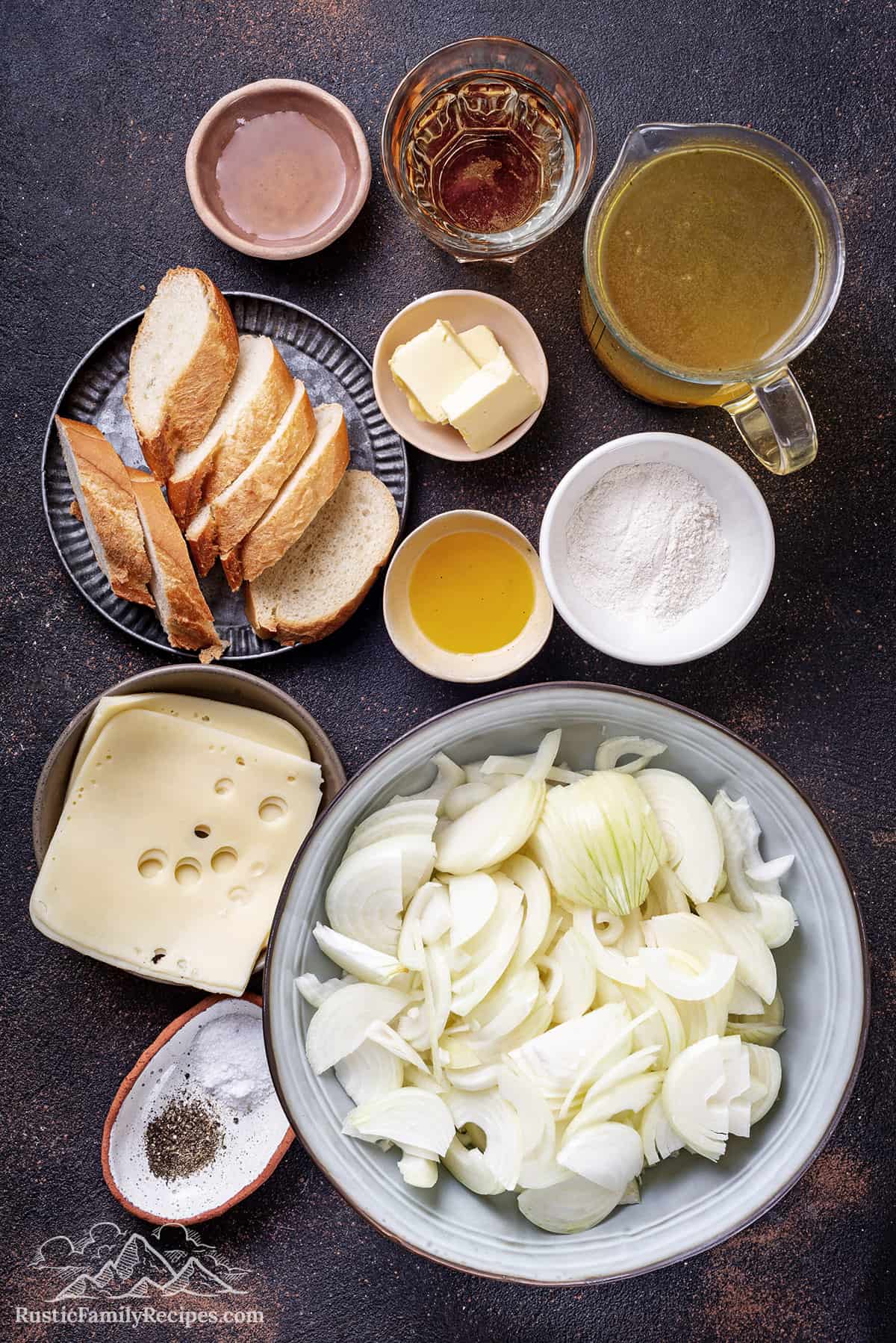 Ingredients for french onion soup on a table