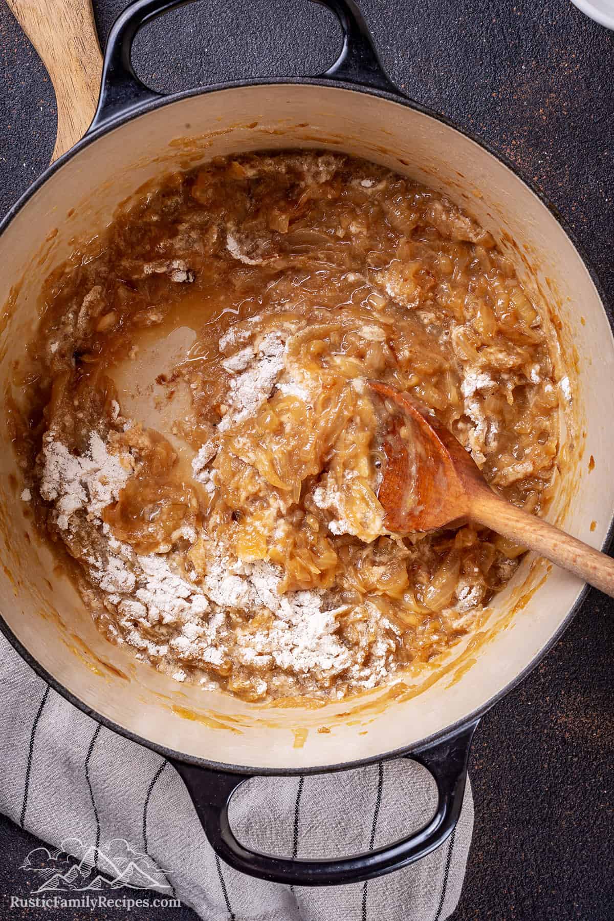 Mixing caramelized onions with flour in a dutch oven