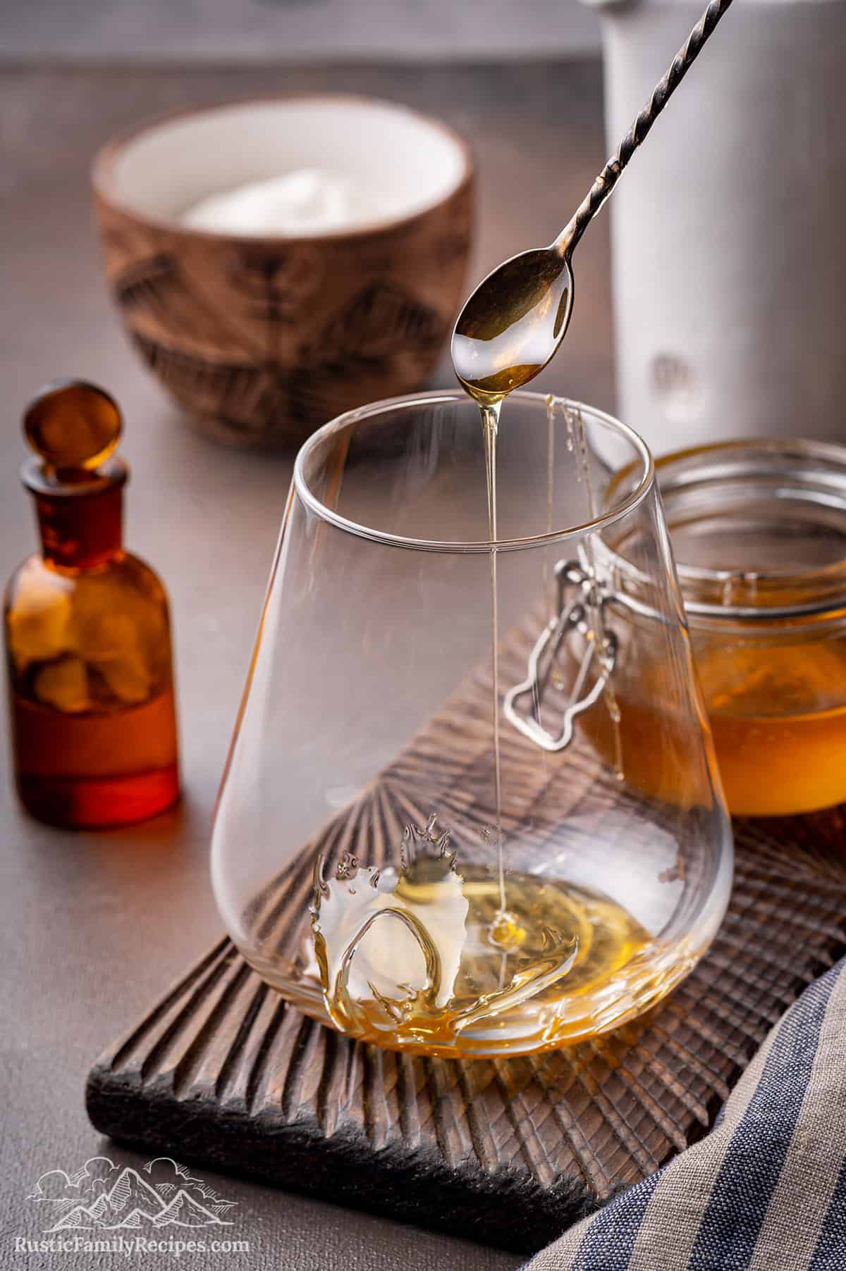 Pouring honey into a glass