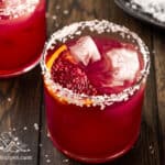 Two glasses of blood orange margarita