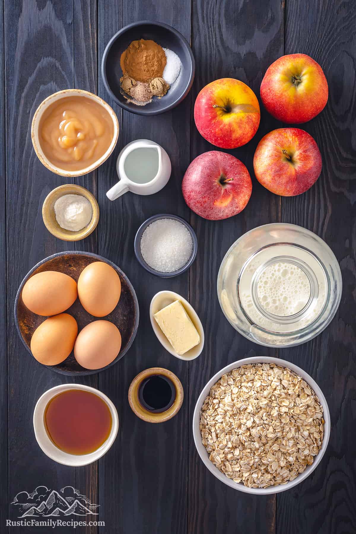 Ingredients for apple cinnamon baked oatmeal on a wood table