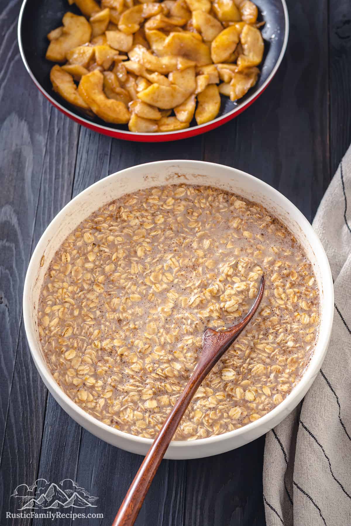 Oat mixture for baked oatmeal in a white bowl