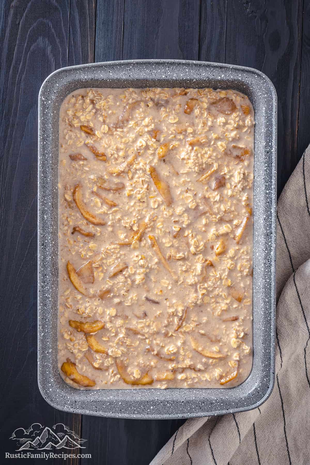 Apple oatmeal in a baking dish ready to go into the oven