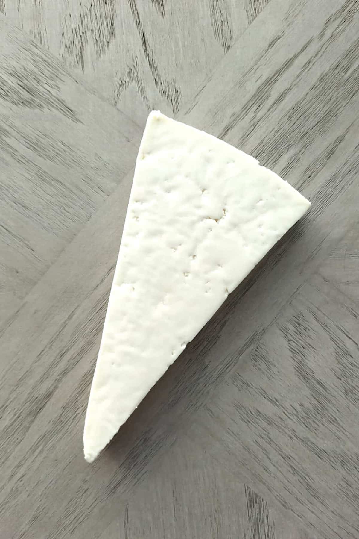 Whole triangle of cotija cheese.