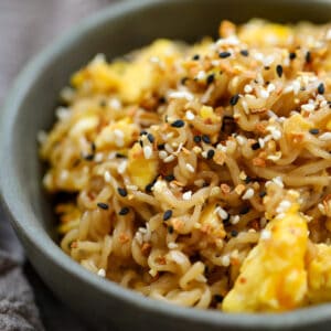 A serving of tik tok ramen with scrambled eggs in a grey bowl