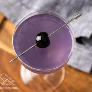 Purple Aviation cocktail with a luxardo cherry