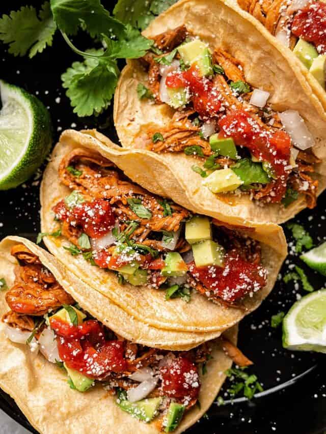 Yucatan pork tacos with toppings.