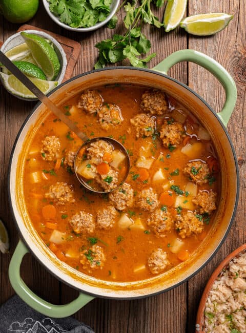 A soup pot filled with albondigas soup