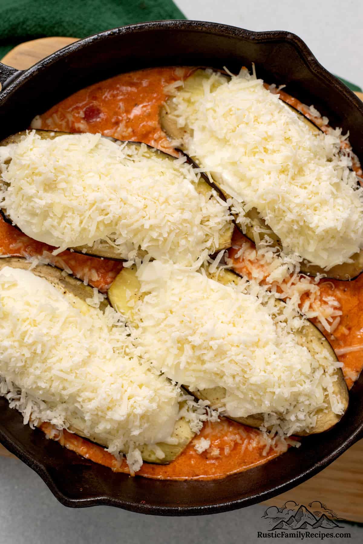 Chicken is topped with cheese to make Chicken Sorrentino.