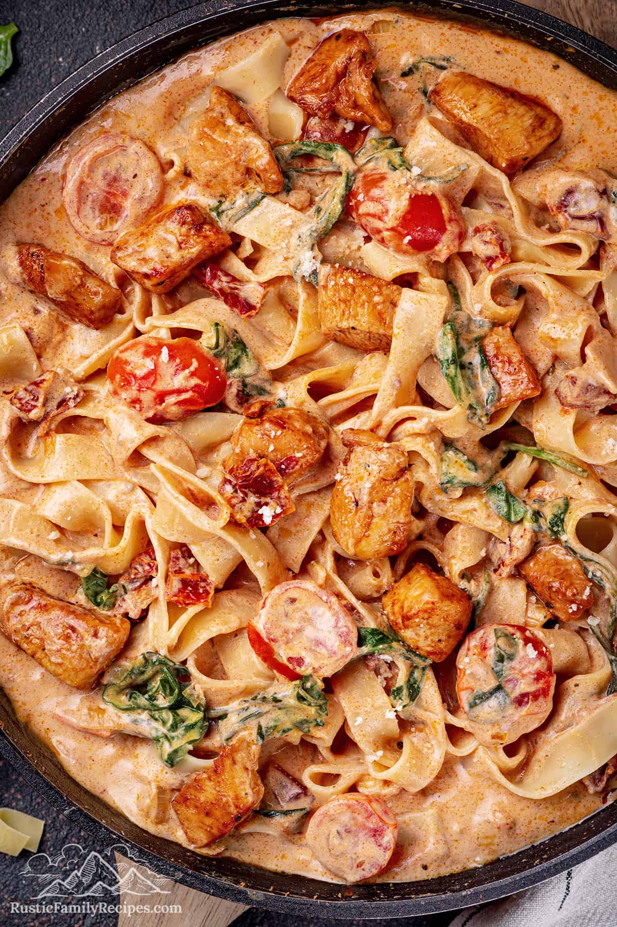 Tuscan chicken pasta in a skillet