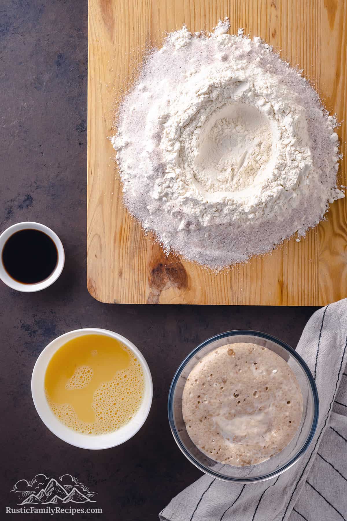 Flour on a cutting board with a well in the center