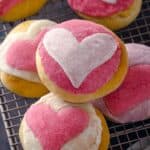A stack of pink conchas with hearts
