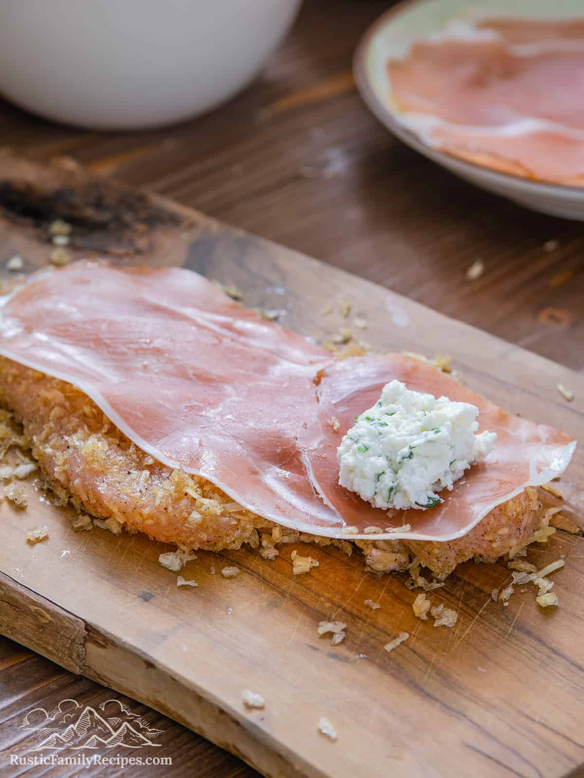 Breaded chicken topped with prosciutto and ricotta filling