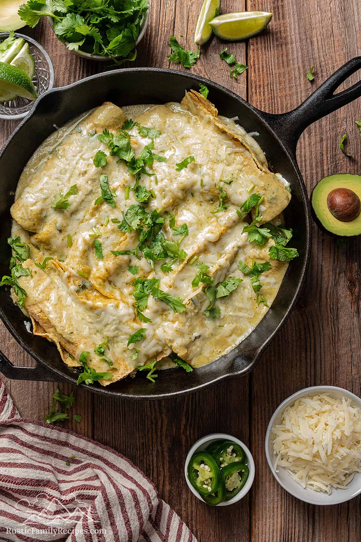 Skillet filled with enchiladas suizas. 
