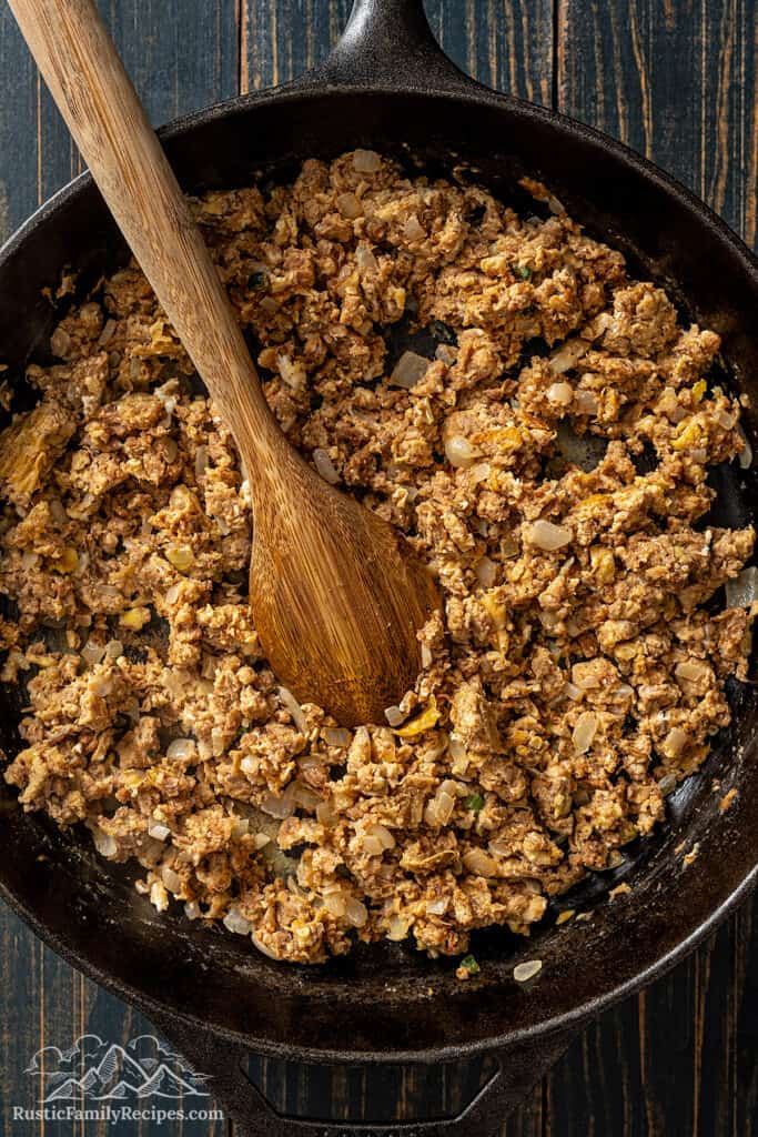 Cooked machaca and eggs mixture in the pan.