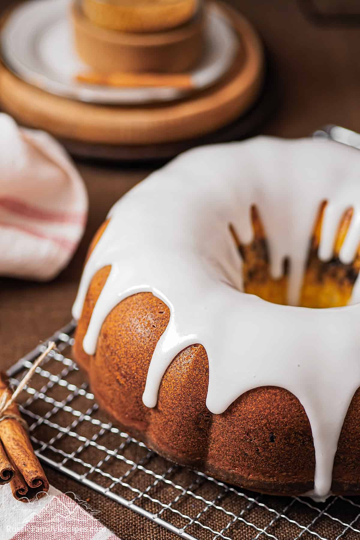 Glazed Sock it to Me Cake on a wire rack