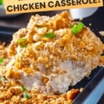 A scoop of million dollar chicken casserole being taken out of a baking dish.