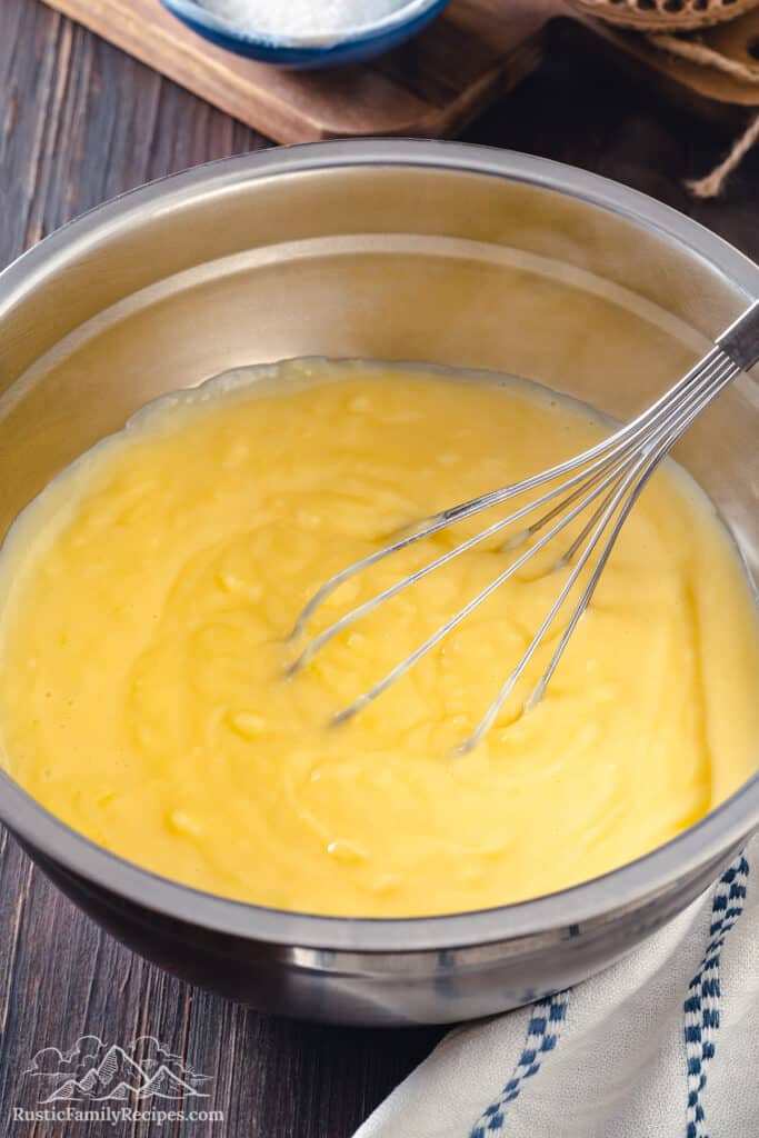 Bavarian cream in a bowl with a whisk.