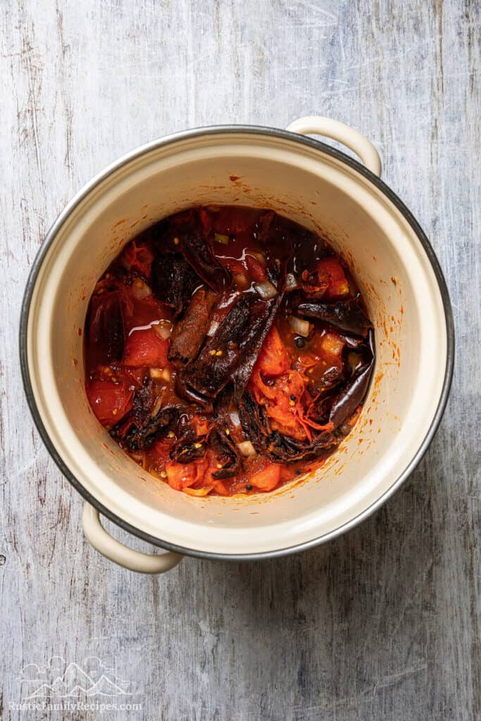 Cooked birria sauce ingredients inside a large pot.