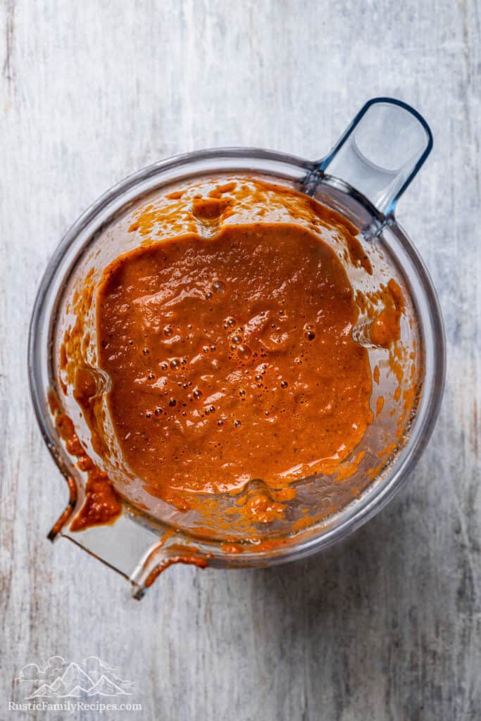 Pureed birria sauce inside a blender.