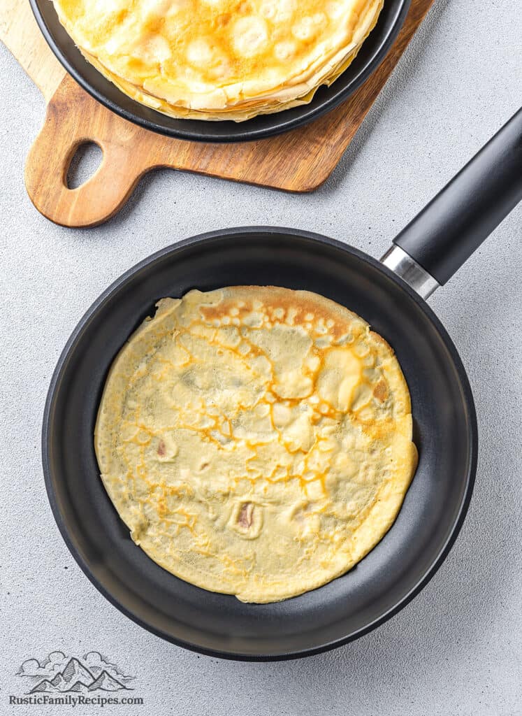 A cooked crepe in a pan