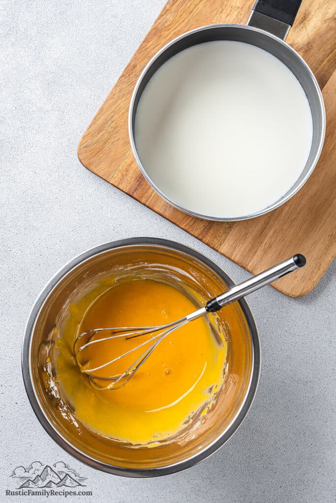 Egg yolks and heavy cream in pots